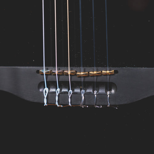 godin_guitars is debuting a pair of all-black nylon-string guitars. The  Arena Pro is a LTD Onyx Black is a single cut with a solid cedar